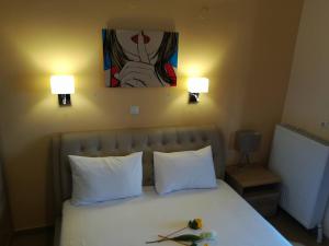 Rúm í herbergi á Olympic Hotel