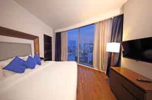 Ein Bett oder Betten in einem Zimmer der Unterkunft Novotel Panama City