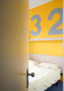 A bed or beds in a room at Hotel Morfeo - Young People Hotels