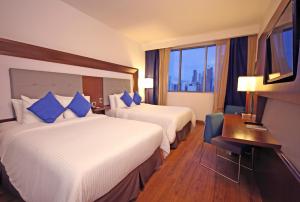 Ein Bett oder Betten in einem Zimmer der Unterkunft Novotel Panama City