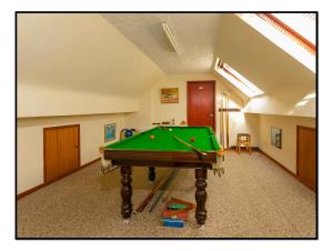 a pool table in the middle of a room at Burndavis Lodge in Ballymena