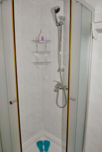 a shower with a glass door in a bathroom at Apartment Piazzeta De Luxe in Split