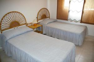 Tempat tidur dalam kamar di Villamar Orange Costa