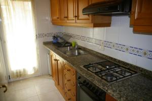 A kitchen or kitchenette at Villamar Orange Costa