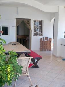 a dining room with a table and chairs in a room at Appartamenti Helvetia in Peschici