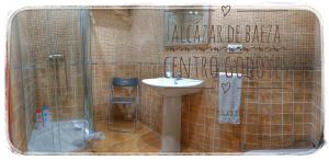 a bathroom with a sink and a shower at Alcazar de Baeza Centro Godoyes in Baeza +28 photos