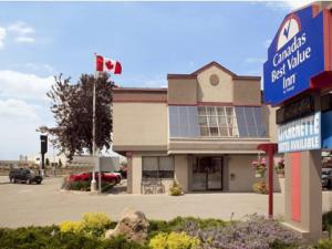 
a large building with a sign on the side of it at Canadas Best Value Inn Toronto in Toronto
