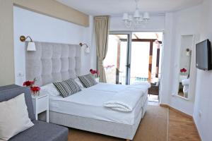 Łóżko lub łóżka w pokoju w obiekcie Hotel Delfin