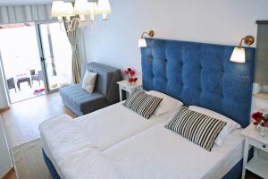 Łóżko lub łóżka w pokoju w obiekcie Hotel Delfin
