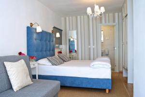 Łóżko lub łóżka w pokoju w obiekcie Hotel Delfin