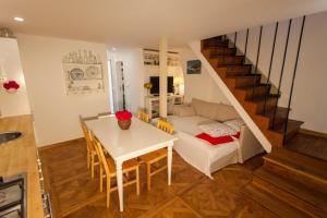 a living room with a table and a couch at Barbarossa House with parking in Cres