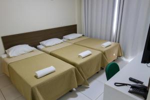 Cama ou camas em um quarto em Velit Hotel
