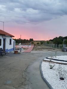 an empty parking lot with a building under construction at Monte Loureiro-caveira in Melides