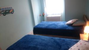 Łóżko lub łóżka w pokoju w obiekcie Apartment Joanna Grau de Gandia