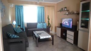 Telewizja i/lub zestaw kina domowego w obiekcie Apartment Joanna Grau de Gandia