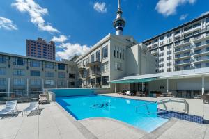 a large swimming pool in the middle of a building at Heritage Luxury & Viaduct Vibe in Auckland