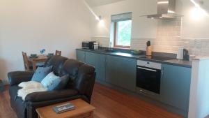 Kuchyň nebo kuchyňský kout v ubytování Curlew Cottage