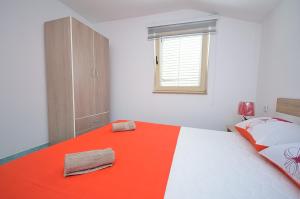 Postel nebo postele na pokoji v ubytování Apartmani Ana