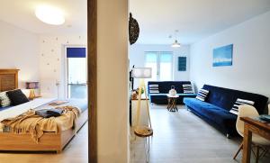 Posteľ alebo postele v izbe v ubytovaní SPA Polanki PARK Nemo Apartamenty Kołobrzeg