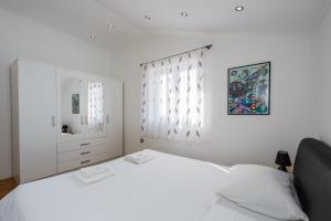 Posteľ alebo postele v izbe v ubytovaní Apartments Selak