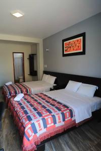 Cama o camas de una habitación en Hotel Vicente de la Vega