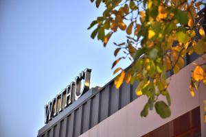 a building with a sign on top of it at With U Hotel & Guesthouse in Sokcho