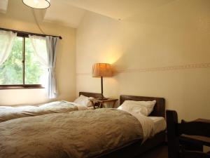 Un pat sau paturi într-o cameră la Garden Pension Obergurgl