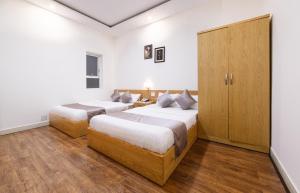 Postel nebo postele na pokoji v ubytování Thanh Thanh Spa & Hotel