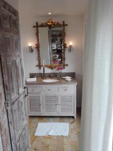 a bathroom with a sink and a mirror at Candelaria House Boutique in Bogotá