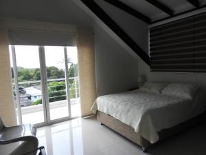 Postel nebo postele na pokoji v ubytování Lili House