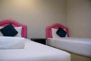 Postel nebo postele na pokoji v ubytování Poi De Ping
