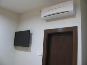a room with a air conditioner on the wall at Fargo Boutique Hotel in Kuantan +17 photos