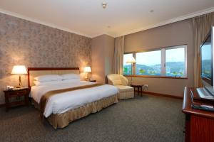 Gulta vai gultas numurā naktsmītnē Evergreen Laurel Hotel - Keelung