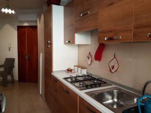 a kitchen with a stove and a sink in it at Cerasella in Cetara