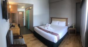 Postel nebo postele na pokoji v ubytování D-ONE Hotel