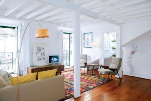 a living room with a couch and a table at 18th Century Loft in Lisbon