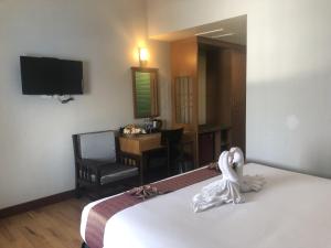 Postel nebo postele na pokoji v ubytování D-ONE Hotel