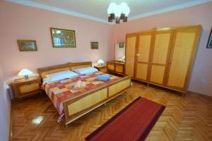 Postel nebo postele na pokoji v ubytování Apartments Hana