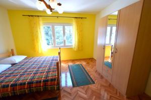 Postel nebo postele na pokoji v ubytování Apartments Hana