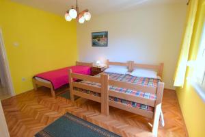Postel nebo postele na pokoji v ubytování Apartments Hana