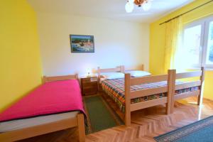 Postel nebo postele na pokoji v ubytování Apartments Hana