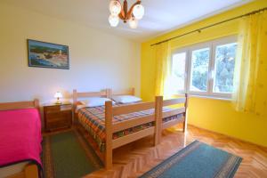 Postel nebo postele na pokoji v ubytování Apartments Hana