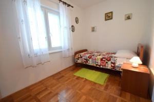 Postel nebo postele na pokoji v ubytování Apartments Hana