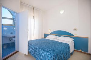 Postel nebo postele na pokoji v ubytování Hotel Golf