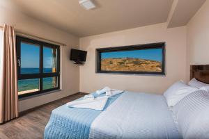 A bed or beds in a room at Villa Menelaos
