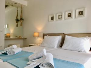 A bed or beds in a room at Alegria Kefalonia