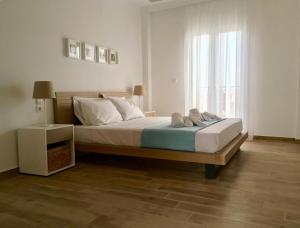 A bed or beds in a room at Alegria Kefalonia