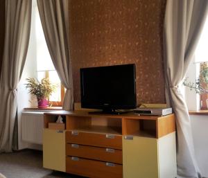 TV a/nebo společenská místnost v ubytování Hotel Merlot