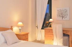 A bed or beds in a room at West Crete Chania - Villa Europa