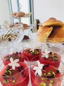 a table with several plates of food on top at Battimandorlo in Noto